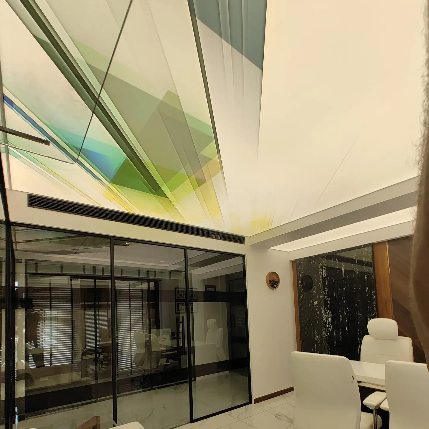 Printed translucent stretch ceiling over an office lobby